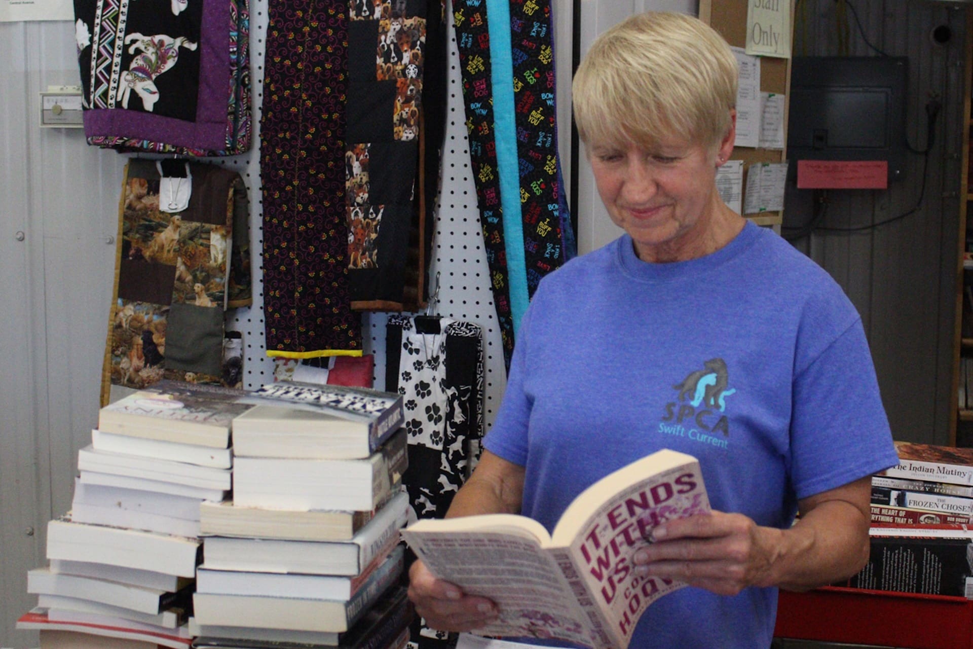 Volunteer working at the SPCA Swift Current Bookstore